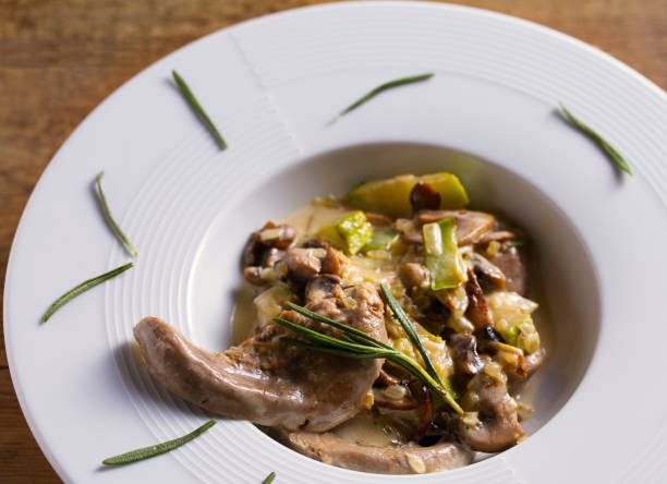 istock Lamb tongues with stewed vegetables and cream sauce 1173536310