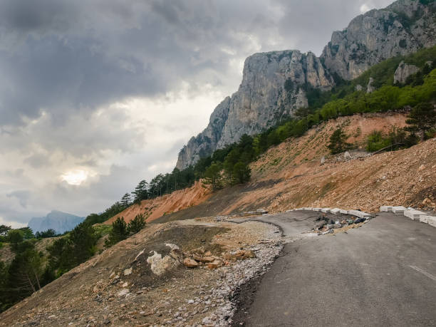 istock Landslide from the cliffs on the mountain road 1173538224