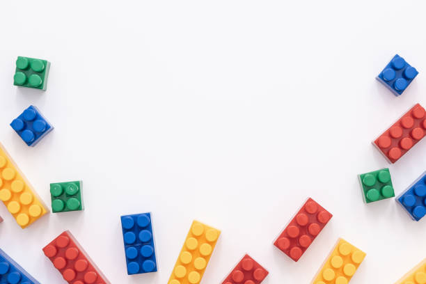 istock On a white background in a chaotic manner are large multi-colored childrens blocks-designer for the construction of houses and buildings of varying complexity. copy space 1173538414