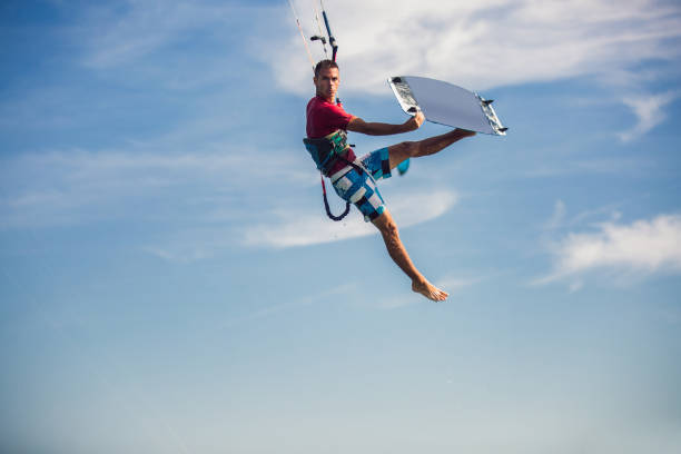istock Professional kiter makes the difficult trick on a beautiful background. 1173543472