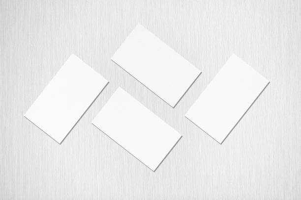 istock Four white rectangle business card mockups on grey background 1173544293