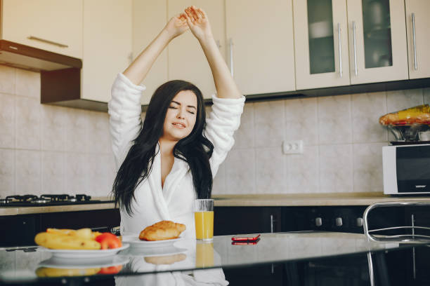 istock girl in a white dressing gown 1173544791