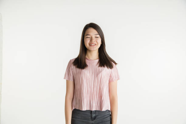 istock Beautiful girl's half-length portrait on white studio background 1173544823