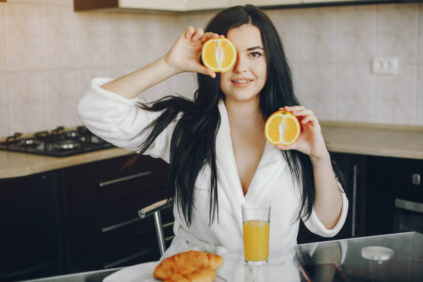 istock girl in a white dressing gown 1173544902