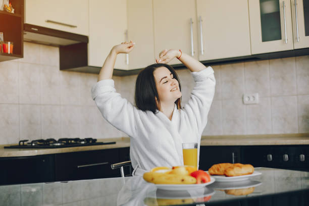istock girl in a white dressing gown 1173546117