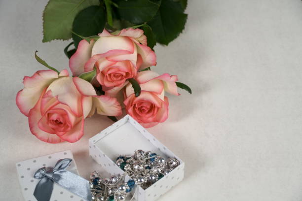 istock dolce vita rose with gift box on white 1173548883