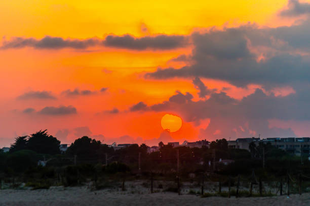 istock Red and orange dramatic colorful clouds lit by evening sunset light, 1173549024