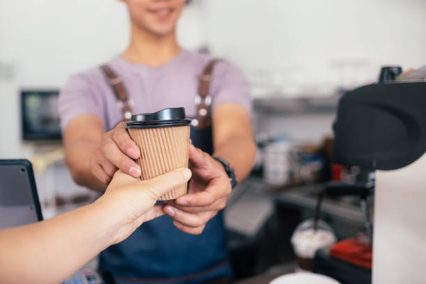 istock Young owner of coffee cafe service customer. 1173550901