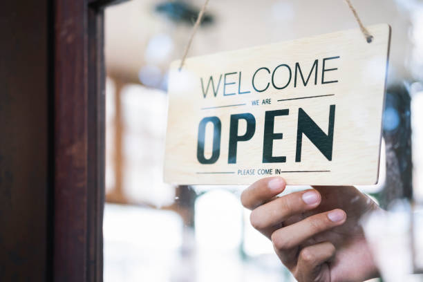 istock Young startup coffee cafe owener open and welcome customer. 1173550977