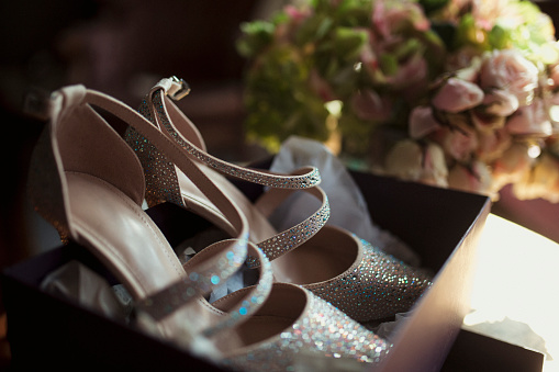 Close up of bridal shoes on the morning of a wedding