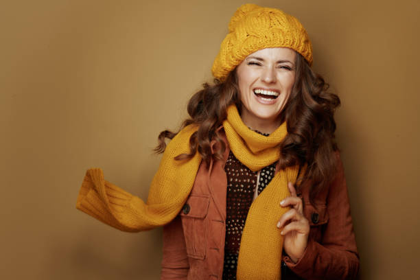 istock cheerful elegant woman isolated on brown background 1173552506