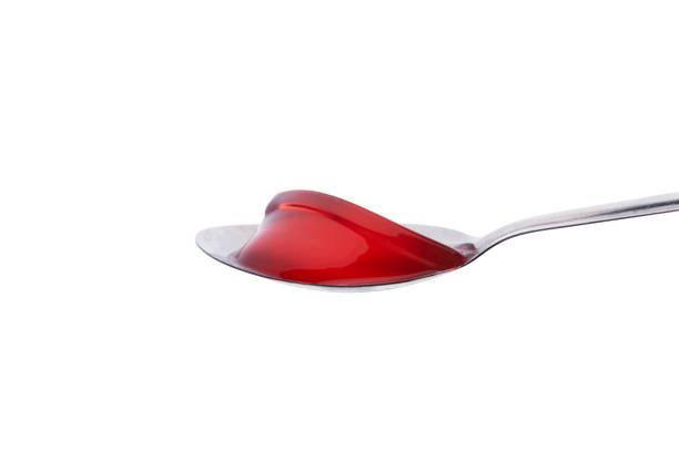 istock strawberry Jelly with spoon on isolated white background 1173553142