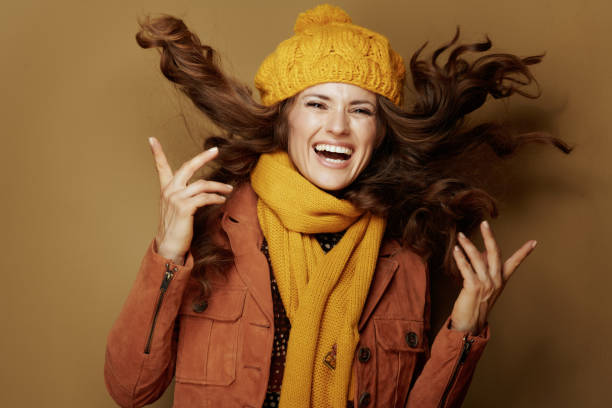 istock happy stylish woman jumping on bronze background 1173553716