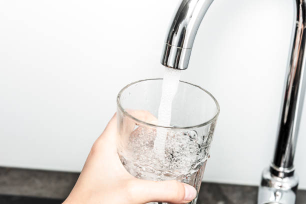 istock Filling glass of water 1173555940