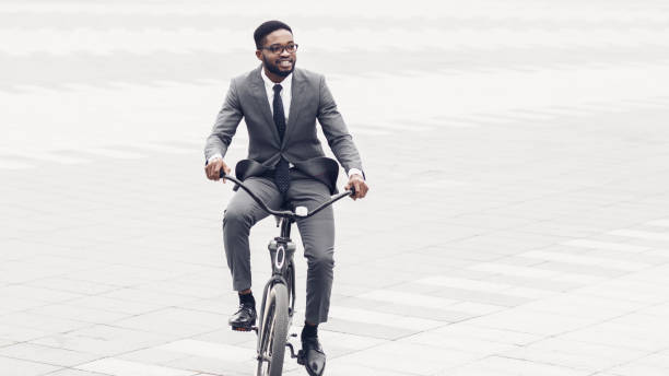 istock Active businessman riding bicycle on the way to job 1173556357