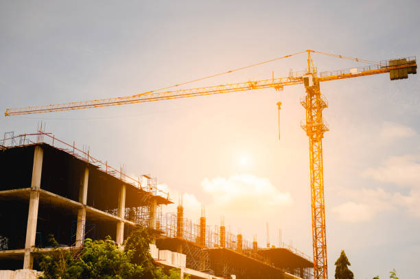 istock Building crane and buildings under construction in the city. 1173556436