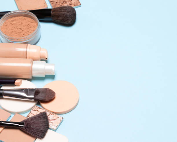 istock Basic makeup products: primer, concealer, foundation, cosmetic face powder. Make-up background, empty space for text 1173557191