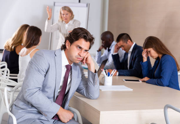 istock Upset man on background with boss scolding subordinates 1173557418