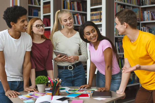 istock Young guy expressing his ideas in front of other students 1173558035