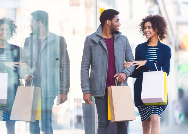 istock Happy african couple in love making shopping on weekend 1173558905