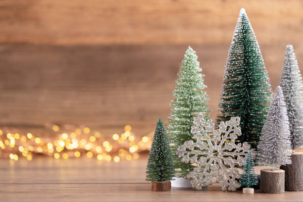 istock Colorful Christmas tree on wooden, bokeh background. 1173559662