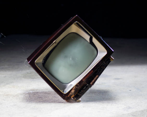 Old tv hitting the ground and breaking