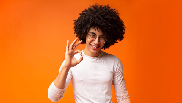 istock Happy black guy gesturing okay sign and smiling 1173561097
