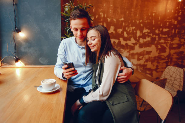 istock cute couple in a cafe 1173561233