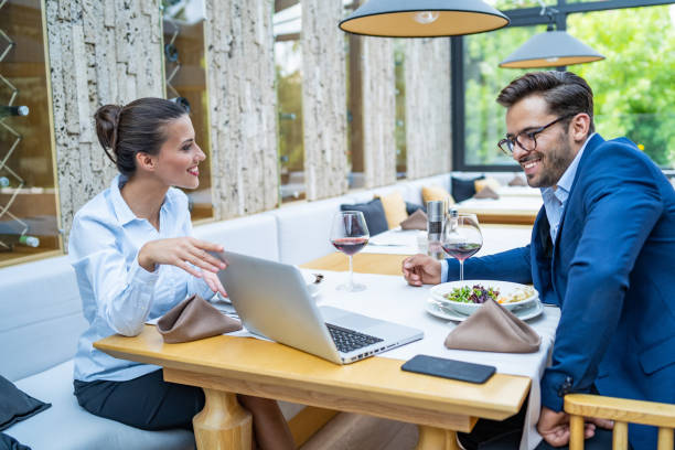 istock Coworkers working in restaurant and using laptop 1173562134