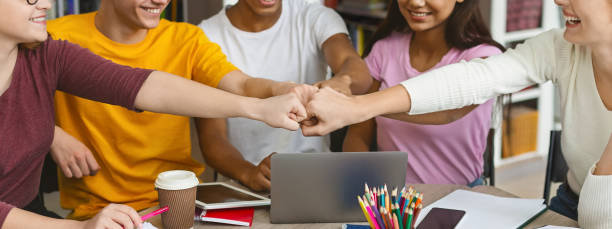 istock Hands of international group of students expressing unity 1173563729