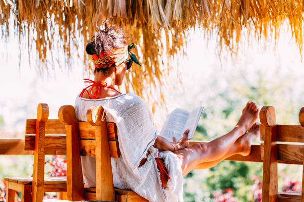 istock Woman Reading a Book in the Bower 1173564045