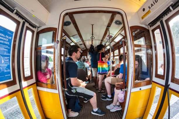 a l'intérieur d'un tram portugais jaune typique - candid downtown district editorial horizontal photos et images de collection