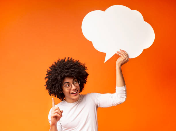 istock Inspired black man holding an empty speech bubble above his head 1173566757