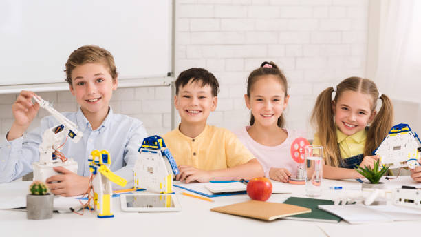 istock Stem education. Children creating robots at classroom 1173566974