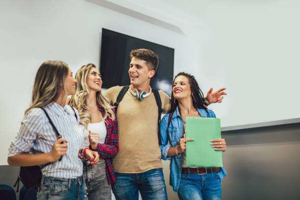 istock Group of students are walking in university hall during break. 1173567013