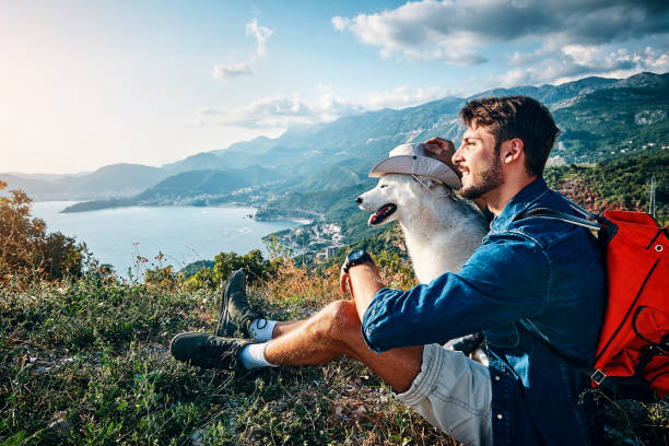 istock man his best friend taking a break from hiking 1173567022