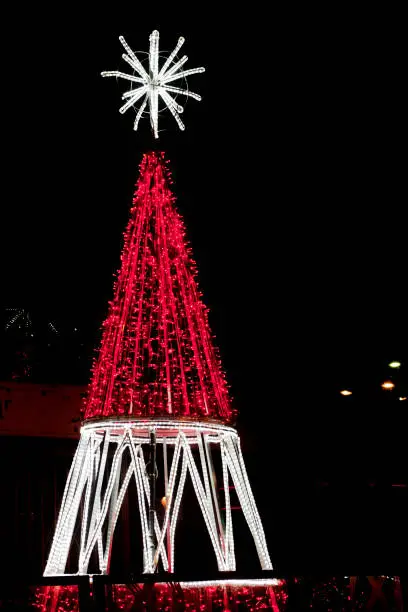 Modern lighting white and red Christmas tree, Vigo townsquare, Galicia, Spain. Copy space on the right.