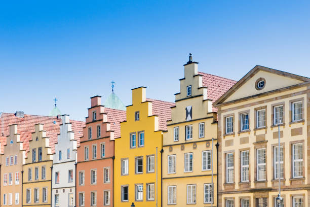 colorful stepped gable houses on market square in Osnabruck, Germany colorful apartments in Osnabrück, Germany lower saxony photos stock pictures, royalty-free photos & images