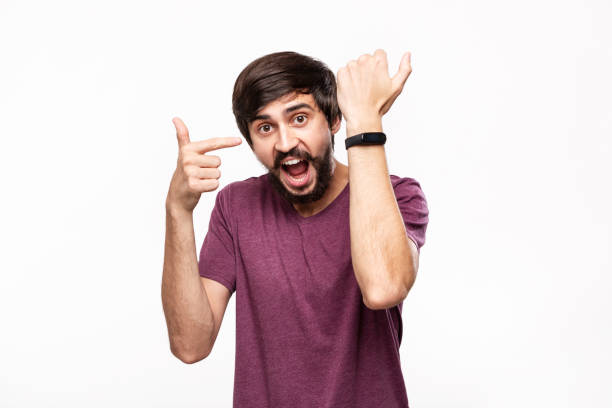istock Excited brunet bearded man with moustaches checking notification with smart watches. Using modern technologies in everyday life. 1173569087