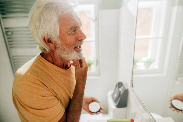 istock Senior man doing his morning routine in bathroom 1173569277