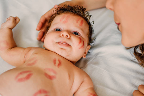 istock Mother with baby on bed having good 1173570252