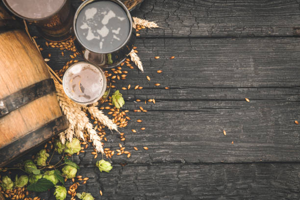 Barrel and Glass beer with Brewing ingredients. Beer background with space for text beer festival photos stock pictures, royalty-free photos & images