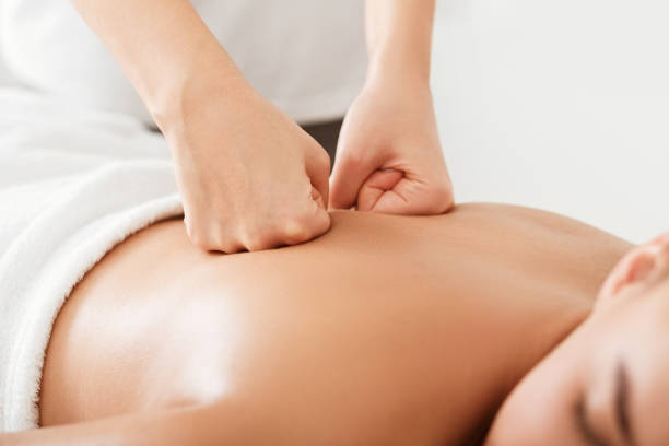 istock Woman receiving body treatment, getting back massage 1173574452