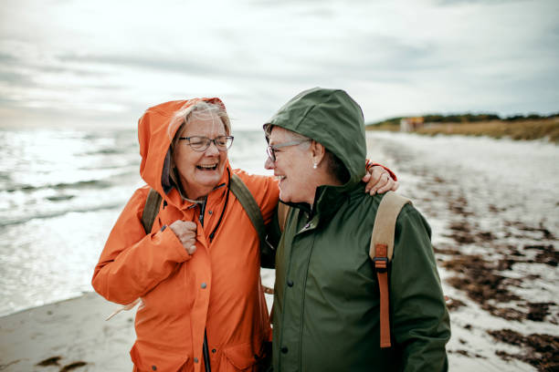 istock Seniors walking by the beach 1173574535