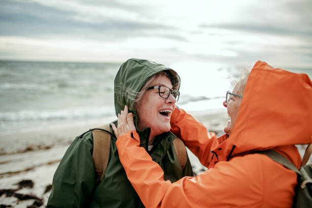 istock Seniors walking by the beach 1173574725