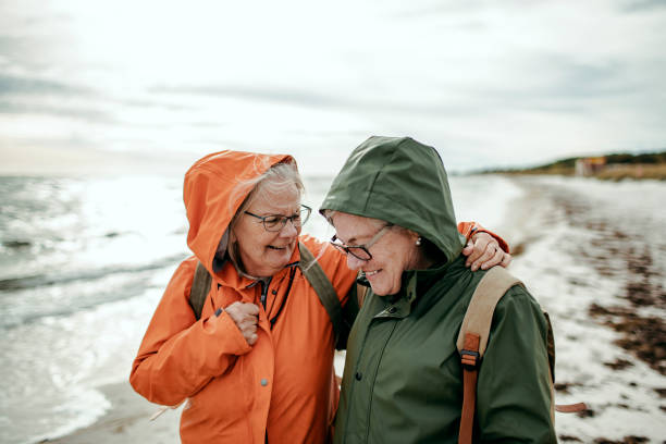 istock Seniors walking by the beach 1173575446
