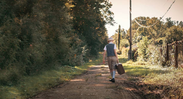 istock Little traveler with suitcase is going to trip 1173577600