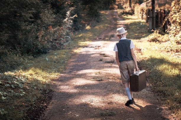 istock Little traveler with suitcase is going to trip 1173577604