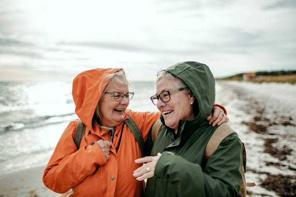istock Seniors walking by the beach 1173577831