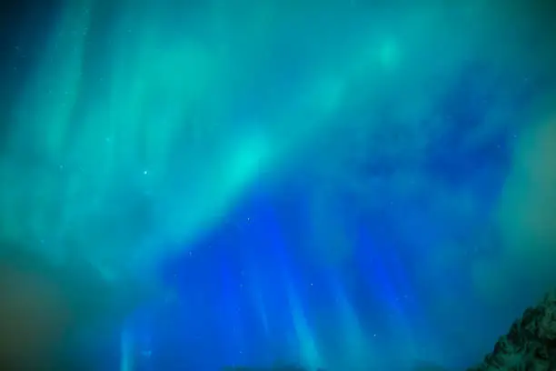 Photo of Amazing Picturesque Unique Nothern Lights Aurora Borealis Over Lofoten Islands in Nothern Part of Norway. Over the Polar Circle.Horizontal Image